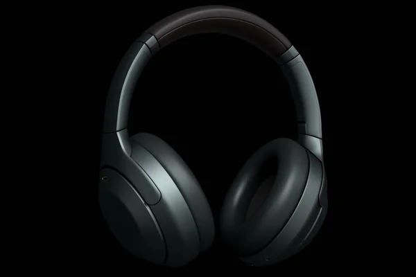 3D rendering of gaming headphones on black background. Concept of cloud gaming and game streaming services