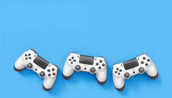 Realistic white video game joysticks or gamepads on blue background. 3D rendering of streaming gear for cloud gaming and gamer workspace concept