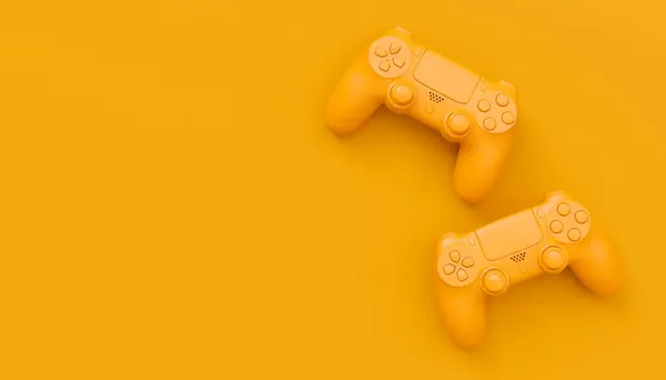 Video game joysticks or gamepads in plain monochrome yellow color background with copy space. 3D render of streaming gear for cloud gaming and gamer workspace concept