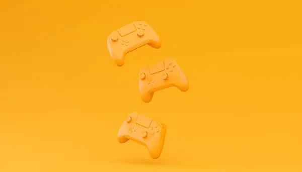 Gry Wideo Joysticks Lub Gamepads Zwykłym Monochromatycznym Żółtym Tle Koloru Zdjęcie Stockowe
