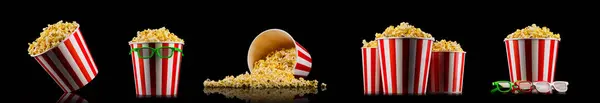 stock image Scattered popcorn from paper striped bucket isolated on black background, concept of watching TV or cinema.