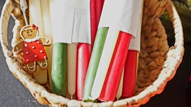 colorful candles in a wicker basket at the fair clipart