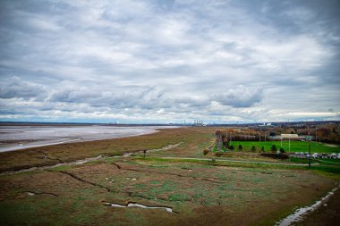 Exploring the beauty of Flint Castle and natural surroundings in Wales clipart