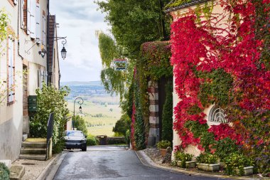 Colorful street in Hautvillers, the capital of Champagne in the autumn of 2017 clipart