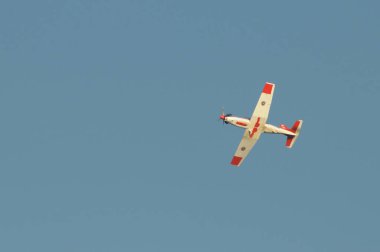 NAKHON PATHOM, THAILAND - January 14, 2023 : stunt flying, Pilatus PC-9 flying pass above venue of national children day at Kamphaeng Saen Aviation School