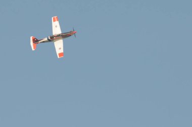 NAKHON PATHOM, THAILAND - January 14, 2023 : stunt flying, Pilatus PC-9 flying pass above venue of national children day at Kamphaeng Saen Aviation School