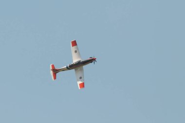NAKHON PATHOM, THAILAND - January 14, 2023 : stunt flying, Pilatus PC-9 flying pass above venue of national children day at Kamphaeng Saen Aviation School