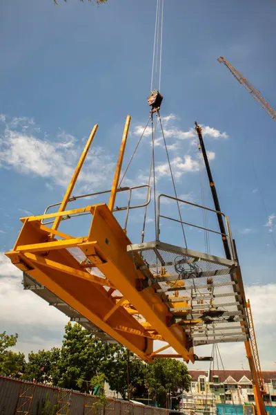 stock image about dismantling process on tower crane and lifting parts of tower crane