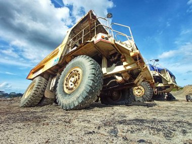 Batu Licin-Indonesia July 17,2022 Large Terex Truck TR50D in open pit mining and processing plant for coal, sand and soil at Mining Area. low angle clipart