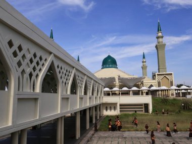 Balikpapan-east Kalimantan November 02,2024  Madinatul Iman Mosque or Balikpapan Islamic Center Mosque with Middle Eastern style dome and tower architecture at Balikpapan-east kalimantan clipart