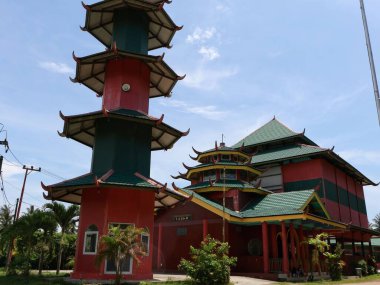 Balikpapan-east Kalimantan November 03,2024 Cheng Ho Mosque at Balikpapan is a mosque and minaret with Chinese Muslim nuances located in front of gate lamaru beach balikpapan clipart