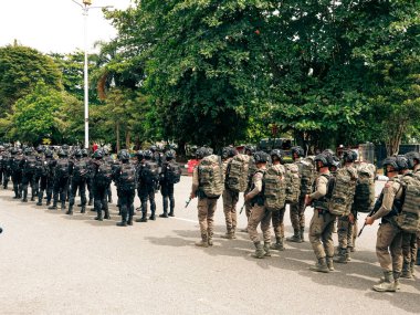 Balikpapan-East Kalimantan 09 November 2024 Indonesian National Armed Forces Day, Soldiers Hold Marching Band Parade with Various Types of Complete Combat Vehicle Uniforms at Merdeka Park clipart