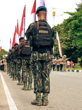 Balikpapan-East Kalimantan 09 November 2024 Indonesian National Armed Forces Day, Soldiers Hold Marching Band Parade with Various Types of Complete Combat Vehicle Uniforms at Merdeka Park clipart