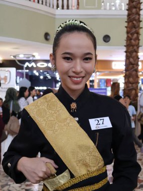 Balikpapan-East Kalimantan November 09,2024, Beautiful Acehnese woman in traditional black Acehnese clothing with selective focus at fashion show clipart