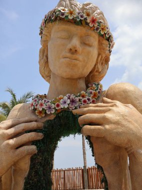 Jakarta, Indonesia - November 23, 2024: An iconic statue of a Hawaiian woman at Aloha Pasir Putih Beach in Pantai Indah Kapuk, North Jakarta. clipart