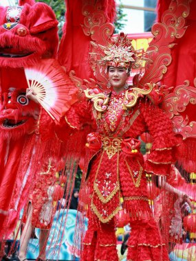 Balikpapan-Indonesia January 29, 2025  Beautiful female dancer wearing traditional Chinese clothing in the Chinese New Year festival at balikpapan clipart