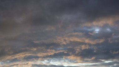 The dark sky with heavy clouds converging and a violent storm before the rain.Bad or night weather sky and environment. carbon dioxide emissions, greenhouse effect, global warming, climate change