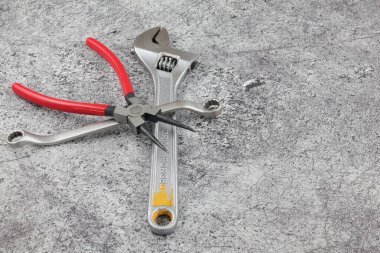 Balikpapan-Indonesia June 20, 2025 snap ring wrench and spinner pliers scattered on the floor