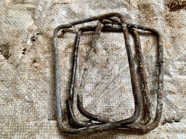 Top-down flat-lay of rusted metal rebar frame. Sharp detail highlights grunge and texture. Perfect for themes: construction, industrial, background, resilience.