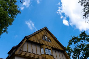 An old wooden roof on a historic building, weathered by time, adds charm to the architectural heritage clipart