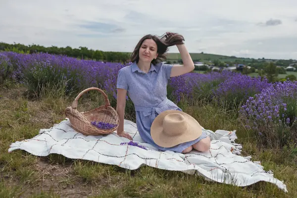 stock image Beautiful Young women in the lavender field. She is rests enjoing.High quality photo