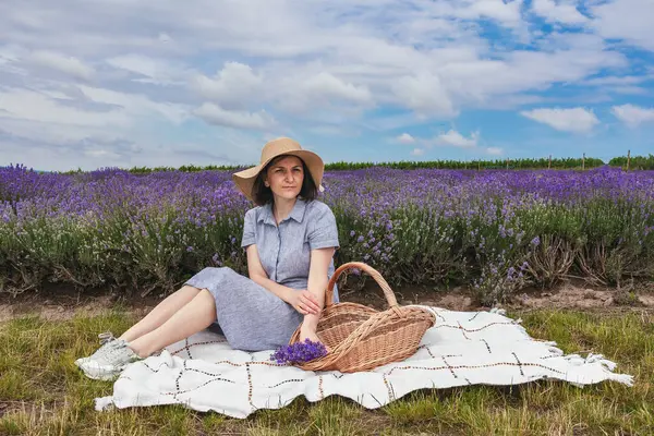 stock image Beautiful Young women in the lavender field. She is rests enjoing.High quality photo