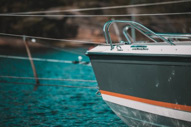 Close-Up of Sailboat Bow with Ropes Tied in Calm Marina Waters in Norway clipart