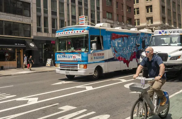 Stock image New York NY USA July 10, 2024 A recreational vehicle plastered with advertising promoting fundraising for Robert F. Kennedys presidential campaign