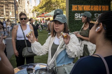 New York NY USA-October 22, 2024 Brand activation of Suja Organic juices in Flatiron Plaza in New York clipart