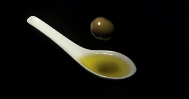 Green Olive Olea Europaea Falling Spoon Black Background Slow Motion — Stock video