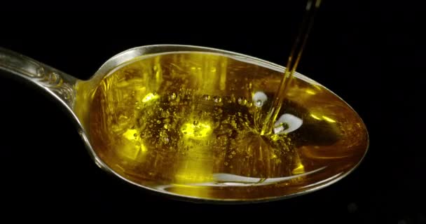 Olive Oil Falling Spoon Black Background Slow Motion — стокове відео
