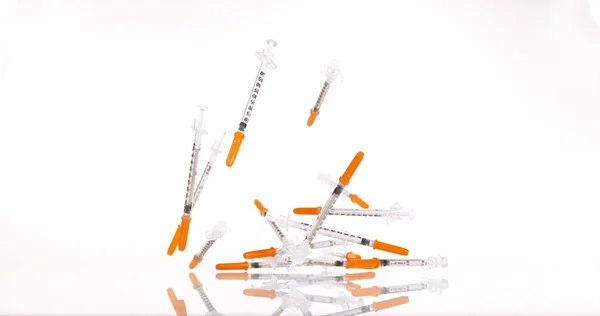 Syringes Falling White Background — Stock Photo, Image