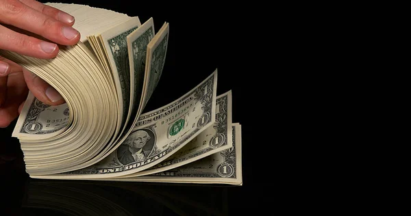Mão Mulher Dólar Notas Bancárias Contra Fundo Preto — Fotografia de Stock