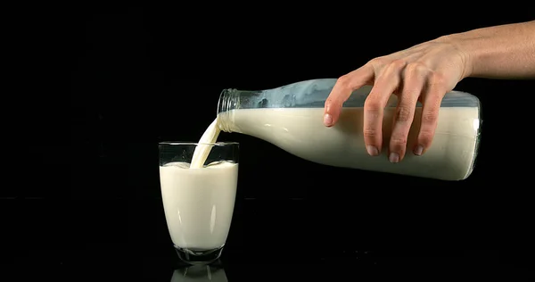 Milk Being Poured Glass Black Background — Stock Photo, Image