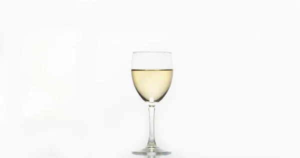 Glass of White Wine against White Background