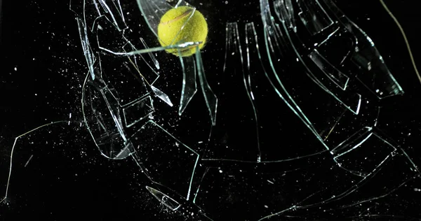 Tennis Ball Breaking Pane Glass Black Background — Stock Photo, Image