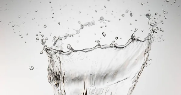 Spurting Agua Contra Fondo Blanco —  Fotos de Stock