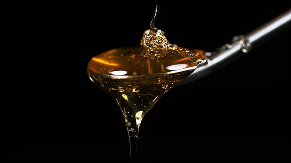 Honey Flowing Spoon Black Background — Stock Photo, Image