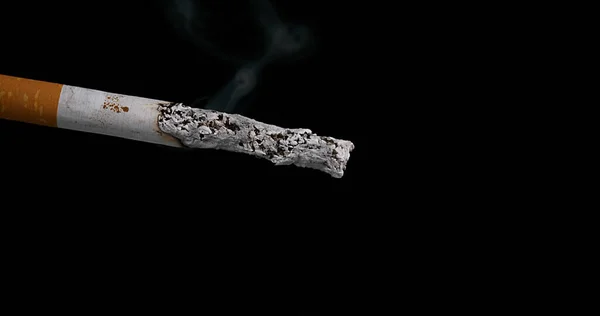 Sigaret Dat Consumeert Zwarte Achtergrond — Stockfoto
