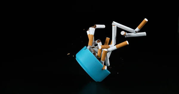 Ashtray Cigarettes Falling Black Background — Stock Photo, Image
