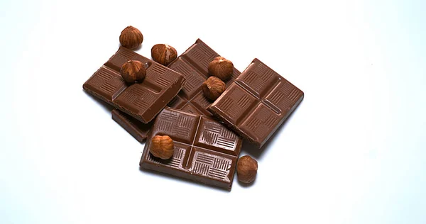 Hazelnuts Falling Milk Chocolate Tablet — Stock Photo, Image