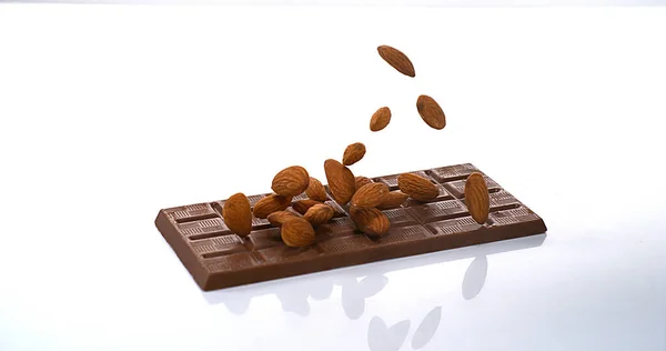 Almonds Falling Milk Chocolate Tablet — Stock Photo, Image