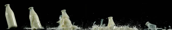 Milchflasche Explodiert Vor Schwarzem Hintergrund — Stockfoto
