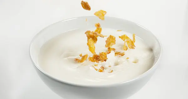 Cereals Falling Milk Bowl White Background — Stock Photo, Image