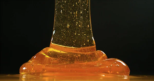 Honey Flowing Black Background — Stock Photo, Image