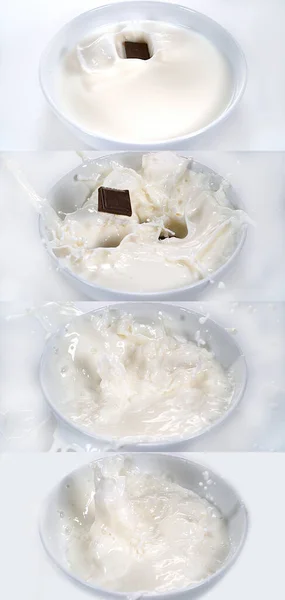 Czekoladki Wpadające Milk Bowl Białym Tle — Zdjęcie stockowe