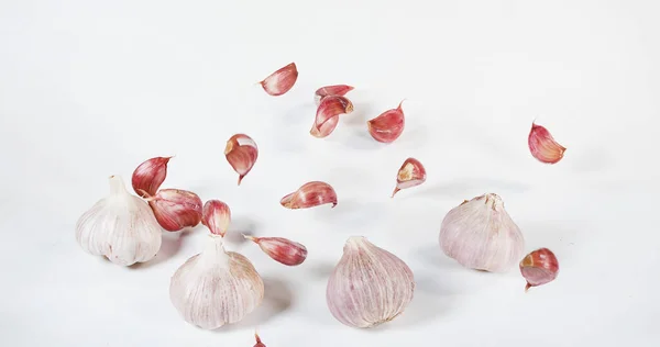 Garlic Allium Savitum Falling White Background Royalty Free Stock Photos