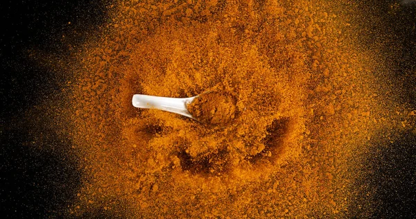 Turmeric Curcuma Longa Powder Exploding Black Background Indian Spice — Stock Photo, Image