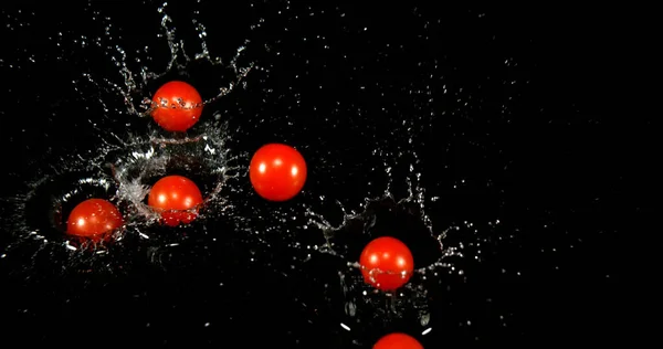 Cherry Tomatoes Solanum Lycopersicum Fruits Falling Water Black Background — Stock Photo, Image