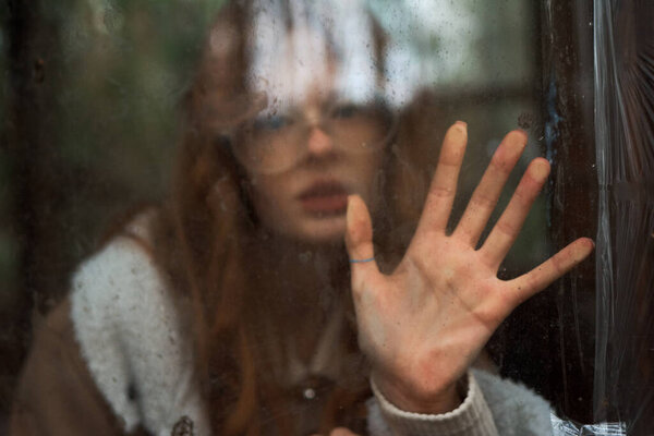 stylish girl with hat and glasses posing in the autumn park